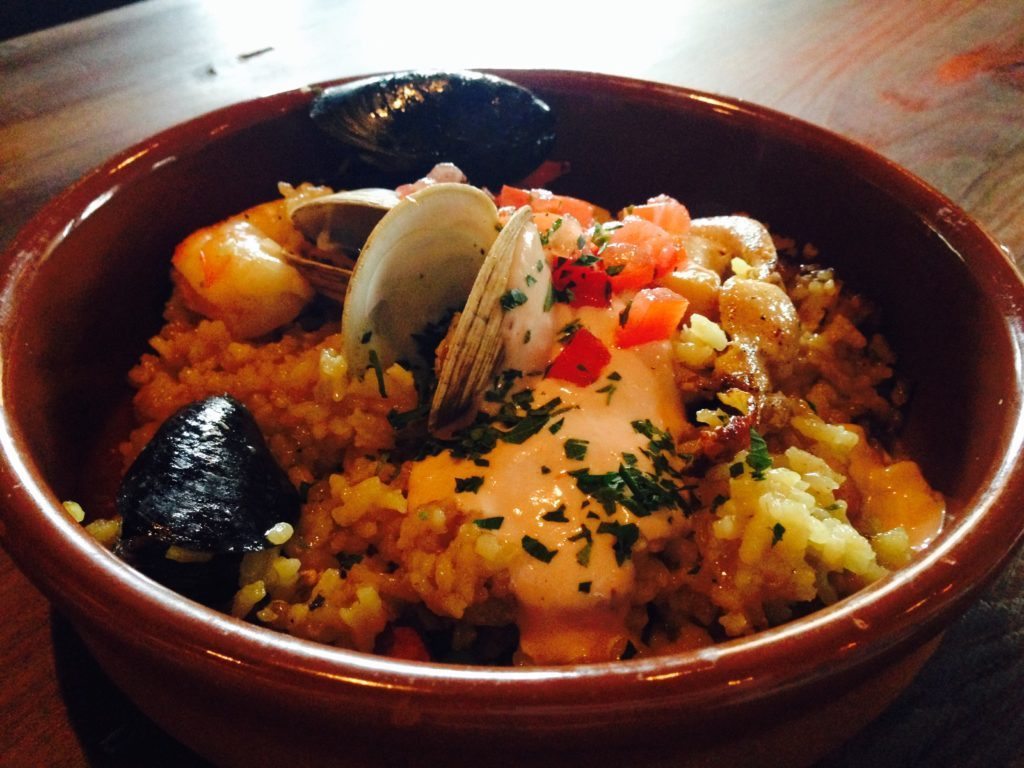 Chef Henry Salgado’s signature wood-grilled paella