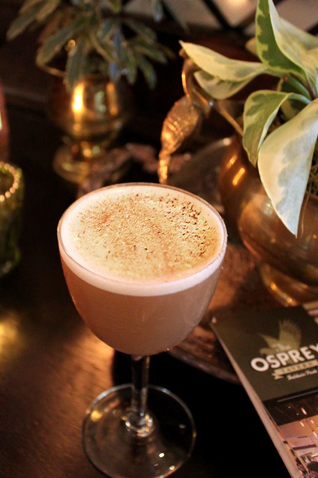This is our Pecan Flip: Pecan infused Old Forester bourbon, Madeira, Demerara, Cynar, egg whites and garnished with fresh ground nutmeg. It is like our version of eggnog!