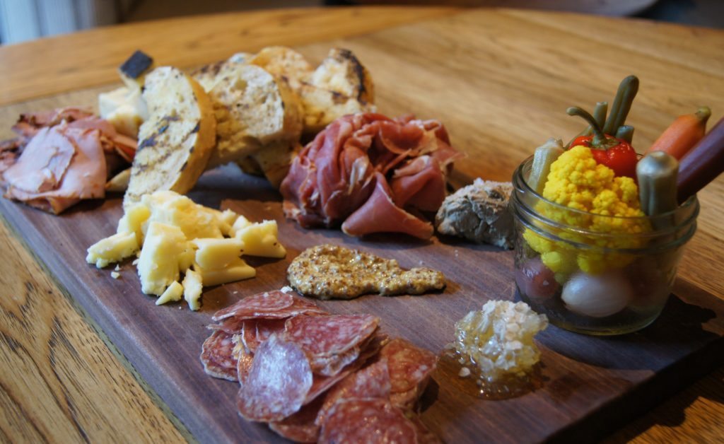 Highball and Harvest's Aged n' Cured with artisan cheeses , house pate, charcuterie, house pickles, toast ($25)