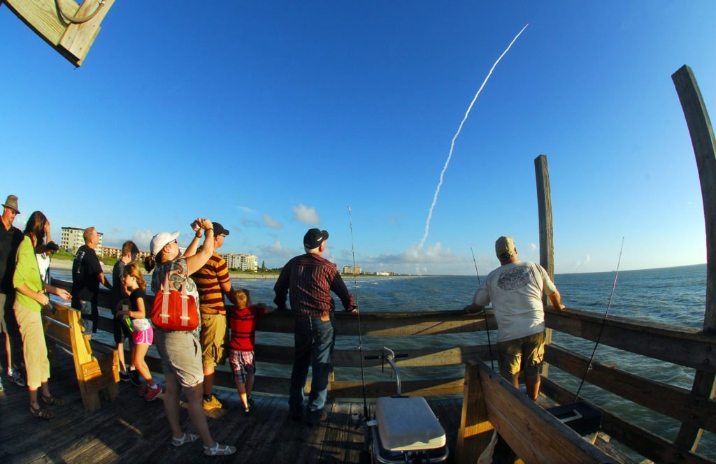 Crowds line the Cocoa Beach Pier to watch Thursday mornings launch of a United Launch Alliance Delta IV rocket launch from the Cape Canaveral Air Force Station ,aboard is a GPS navigation satellite . CRAIG RUBADOUX FLORIDA TODAY