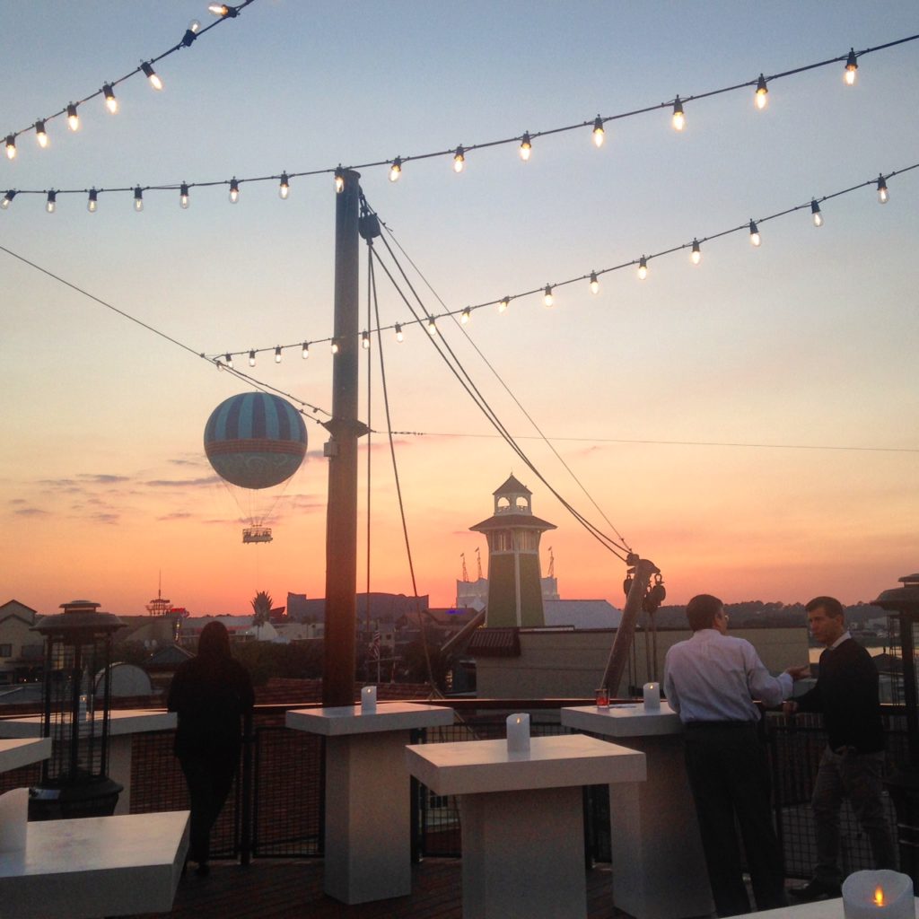 Watch the sunset from the rooftop deck at Paddlefish in Disney Springs