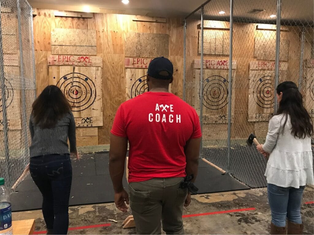 Axe throwing with a coach