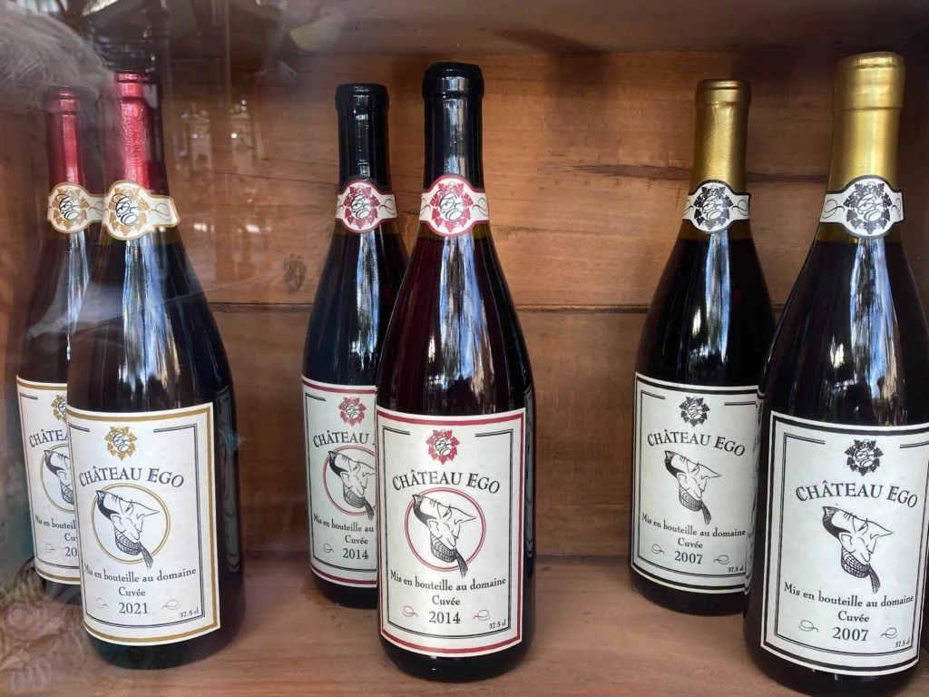 Wine bottles inside a window display near Remy's Ratatouille Adventure contain dates that are relevant to the film and the attractions