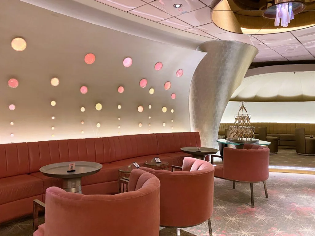 Pink Champagne Lounge on Disney Dream - comfortable velvety seating with muted pink and gold tones