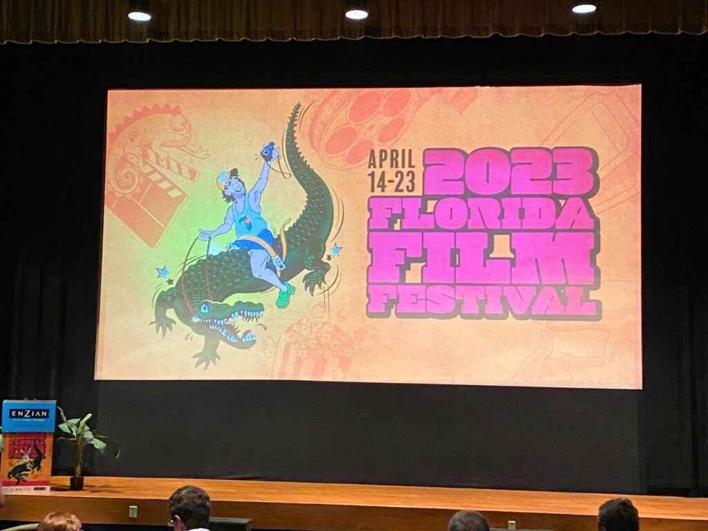 2023 Florida Film Festival logo on screen inside Enzian Theater