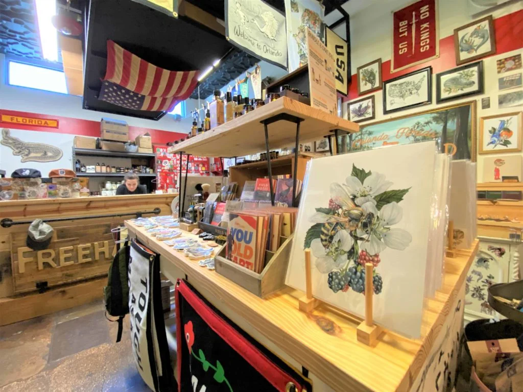 Art, Hats, and other merchandise on display at Freehand Good East End Market