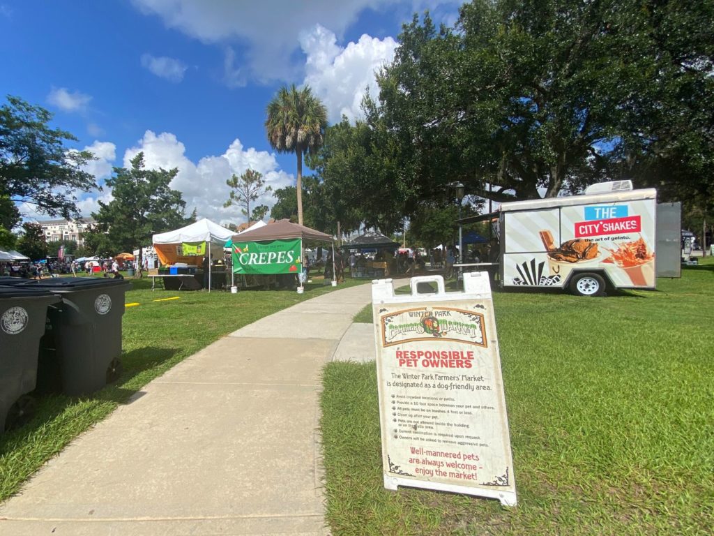 Sign indicating rules for bringing dogs to Dog Friendly Winter Park Farmers' Market