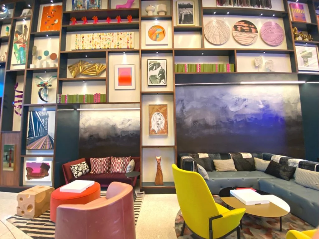 Bright art and colorful furniture at Lake Nona Wave Hotel Living Room Lobby