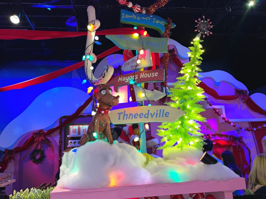 Whoville and The Grinch Room at Universal's Holiday Tribute Store 2022 with a Max the dog figure at the center of the room