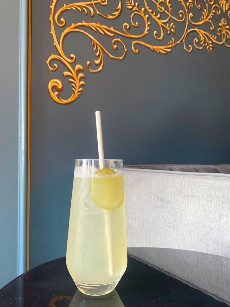 Garden Spritzer Mocktail garnished with a lime wheel at Disney's Enchanted Rose Lounge