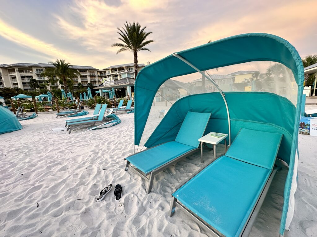 Fins Left Pool Beach Chairs Margaritaville Orlando Resort with sunset in background