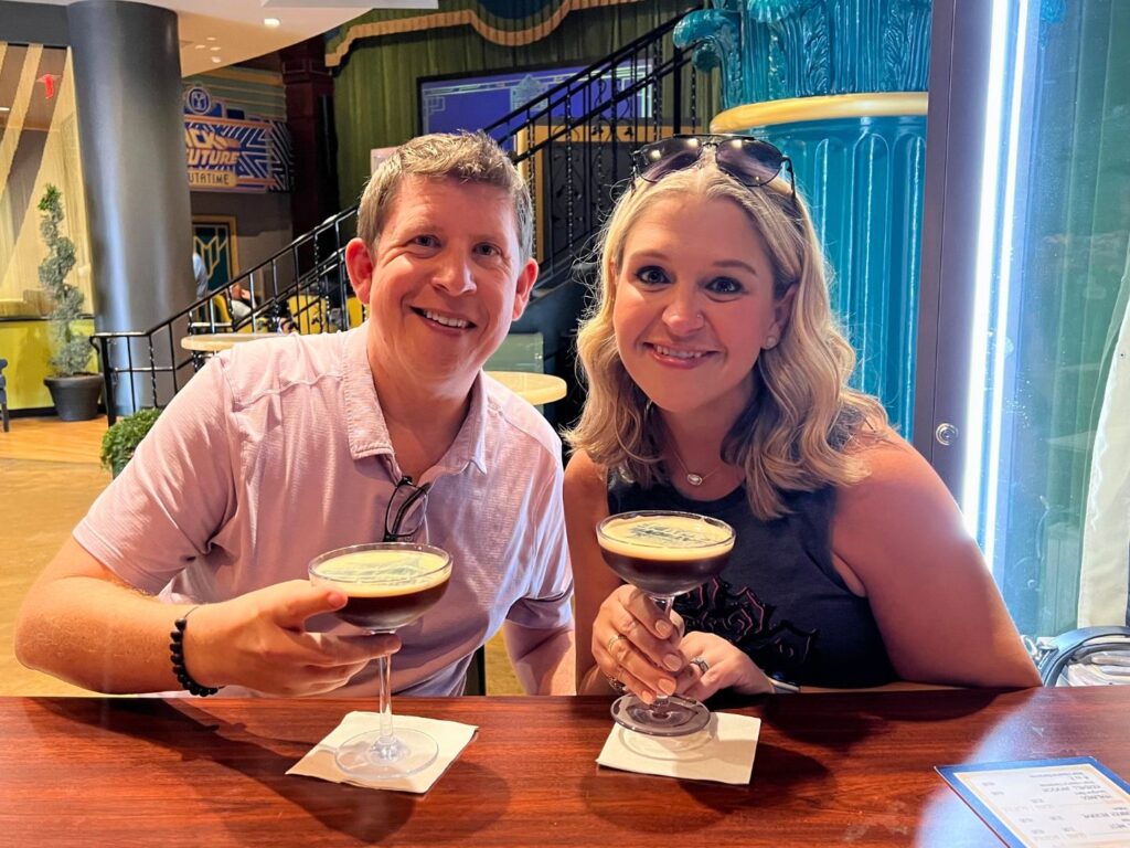Terri Peters and her husband pose with cocktails during Date Night at Universal's Great Movie Escape