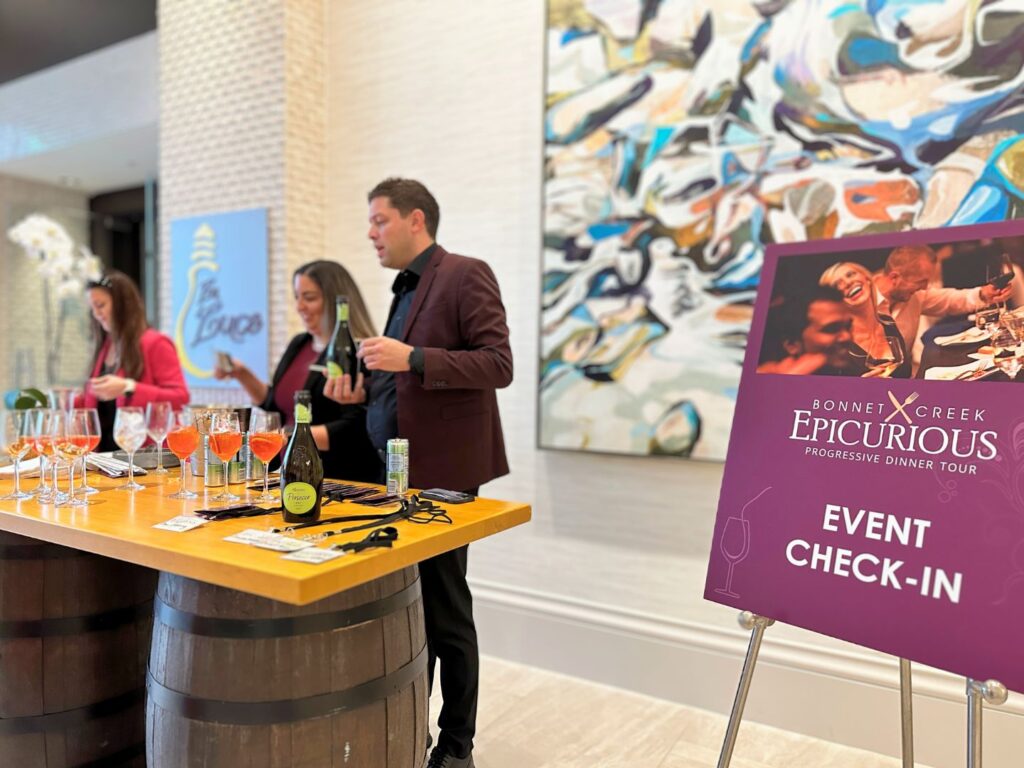 Epicurious Progressive Dinner Tour Welcome Table with welcome drinks and badges