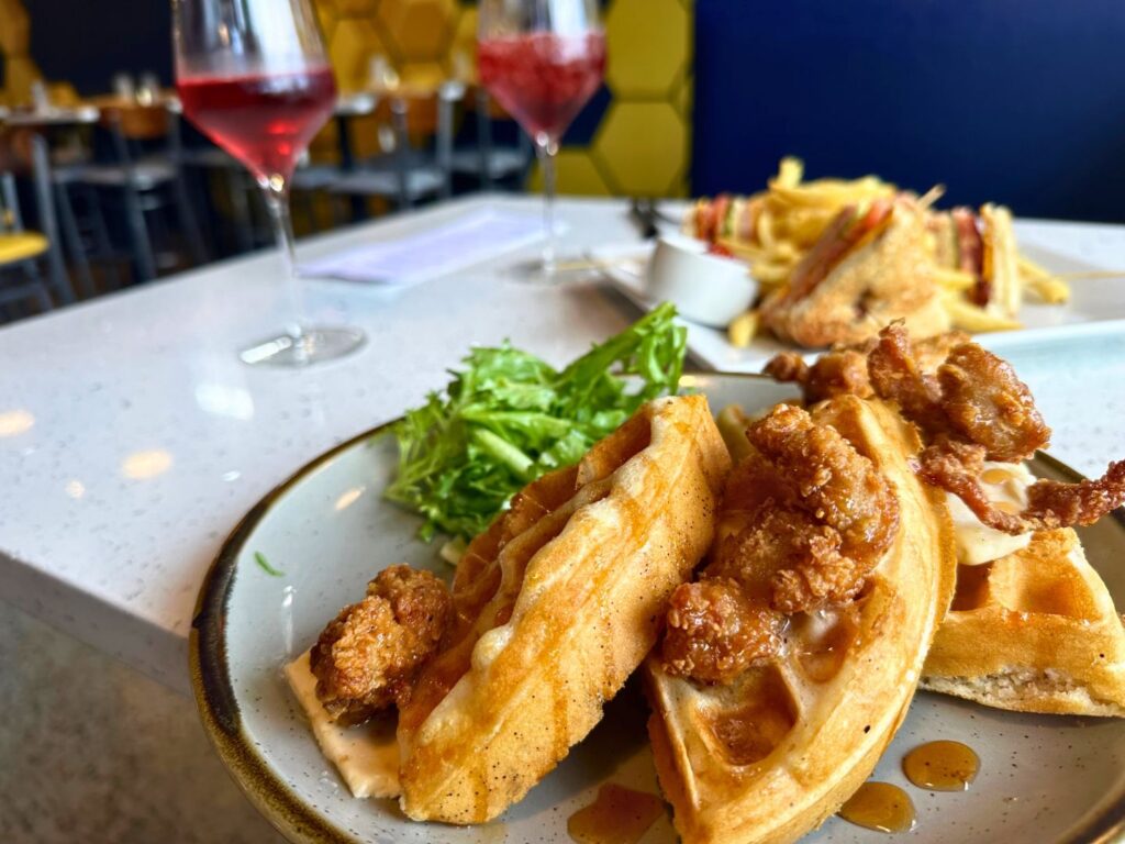 Jack and Honeys Chicken and Waffles Dish with 2 Glasses of Sangria