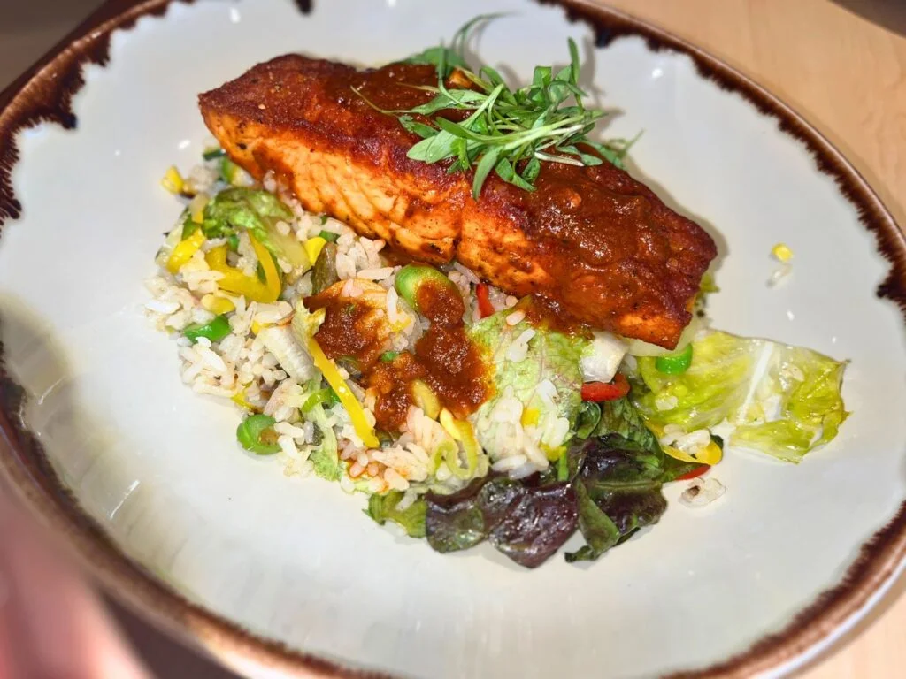 Lunch with salmon and vegetables at Harvest Bistro Signia by Hilton Bonnet Creek Orlando