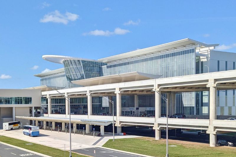 guests sit a bar of Orlando Brewing Airport Terminal C