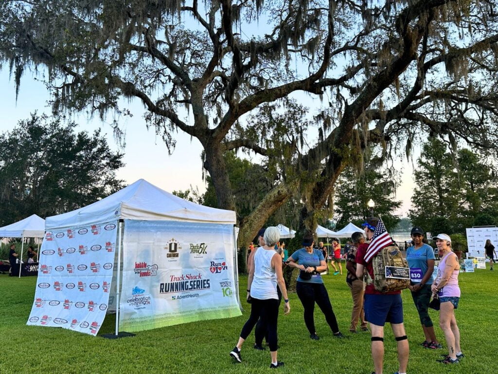 small group of runners gathered at Pre-Race Lake Concord Park Battle of the Bands 5K 