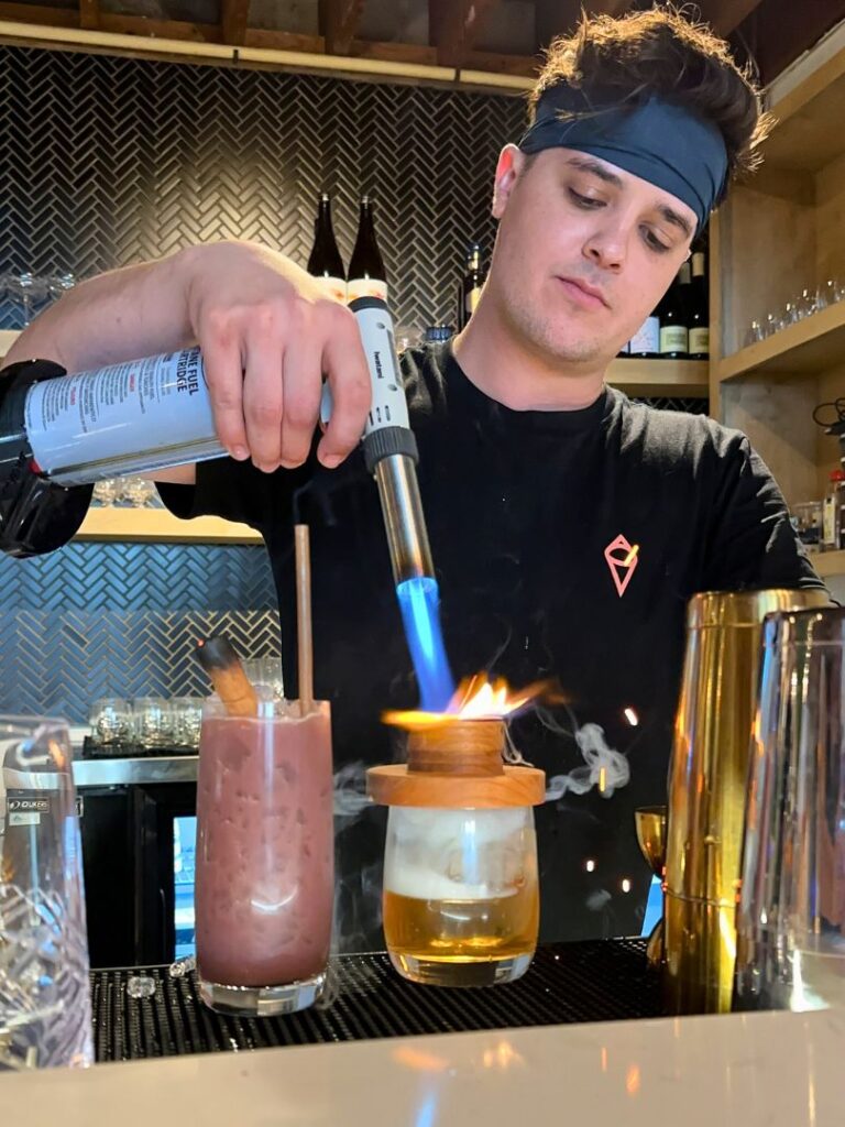 Bartender Makes Craft Cocktails at Sushi Saint Downtown Orlando Restaurant 