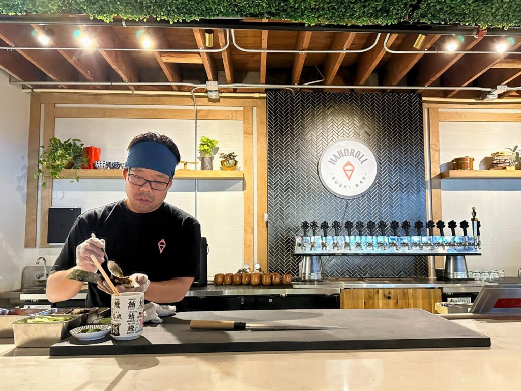 Chef Makes Hand Rolls at Sushi Saint Downtown Orlando Restaurant
