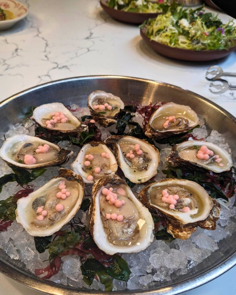 Oysters with Ginger Beer Mignonette and Gari Coconut Pearls at Four Flamingos