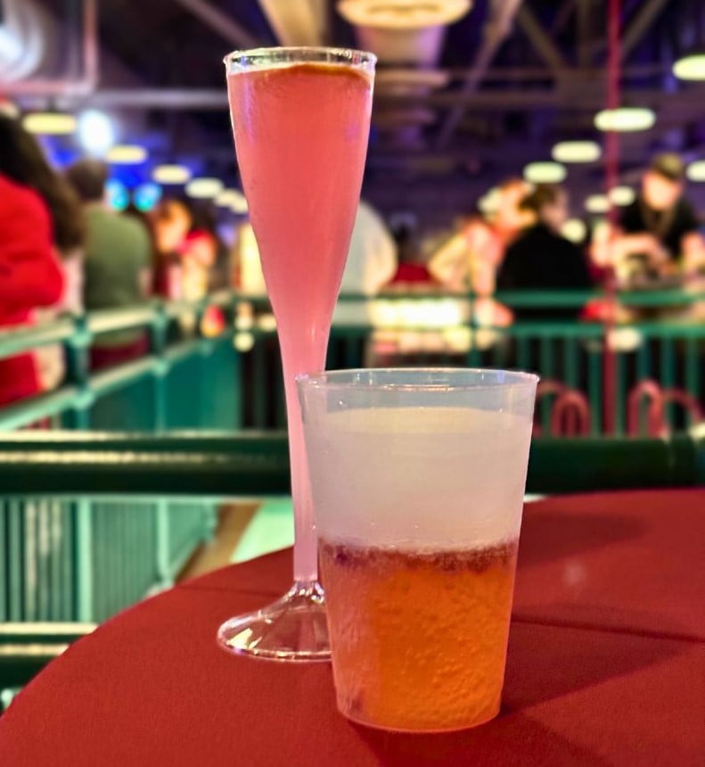 5th Dimension Royale Cocktail and Pomegrante Apple Cider Mocktail on a round table with red table cloth durign Jollywood Nights at Disney's Hollywood Studios
