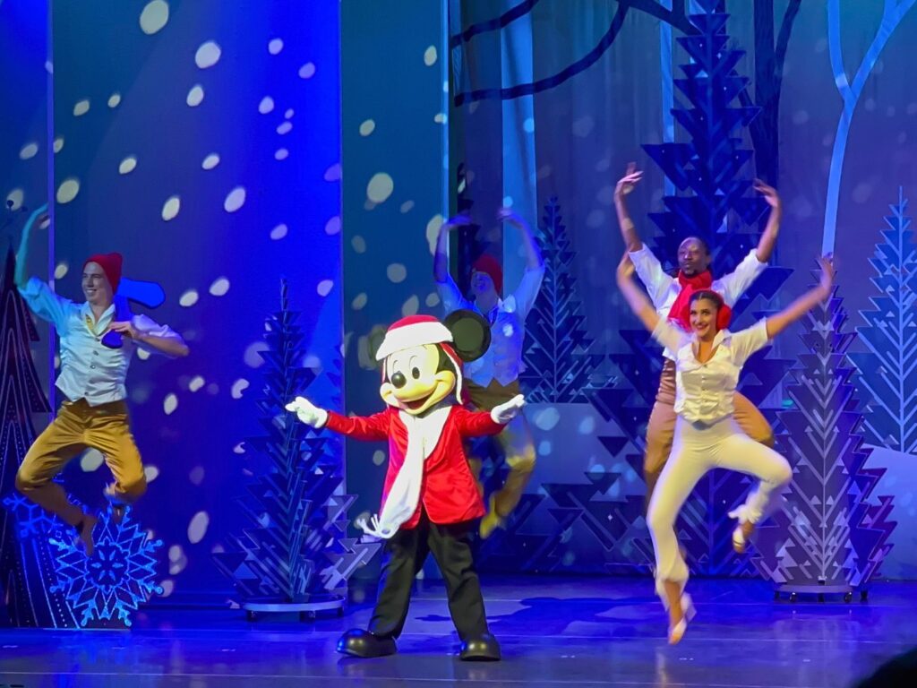 mickey mouse on stage dancing in Disney Holidays in Hollywood Show Mickey Mouse Jollywood Nights 