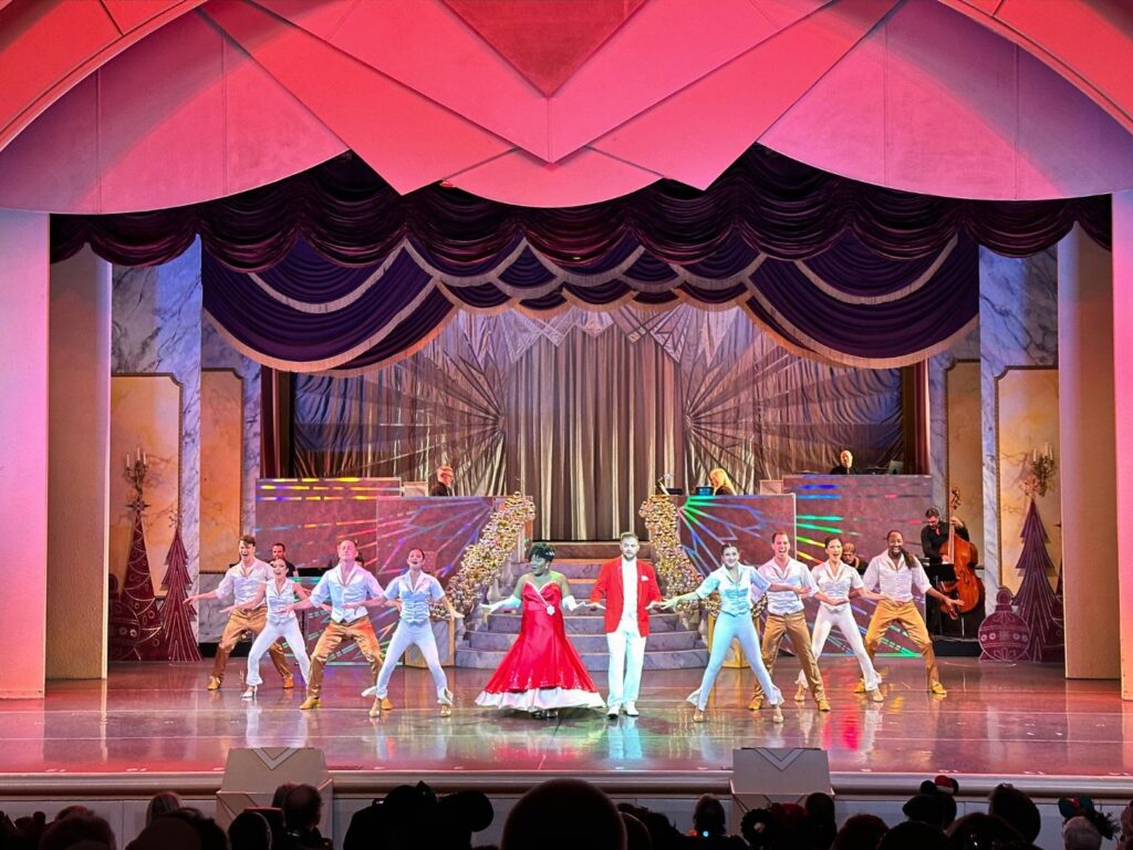cast performs Disney Holidays in Hollywood stage show during disney jollywood nights