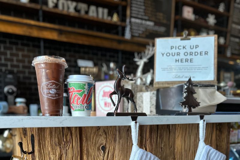 Foxtail Coffee Christmas Seasonal Drinks on counter with holiday decorations