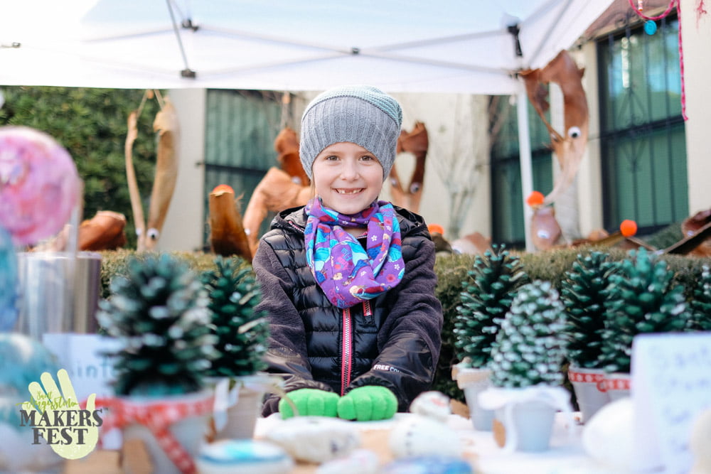 a child poses at St Augustine Makers Fest