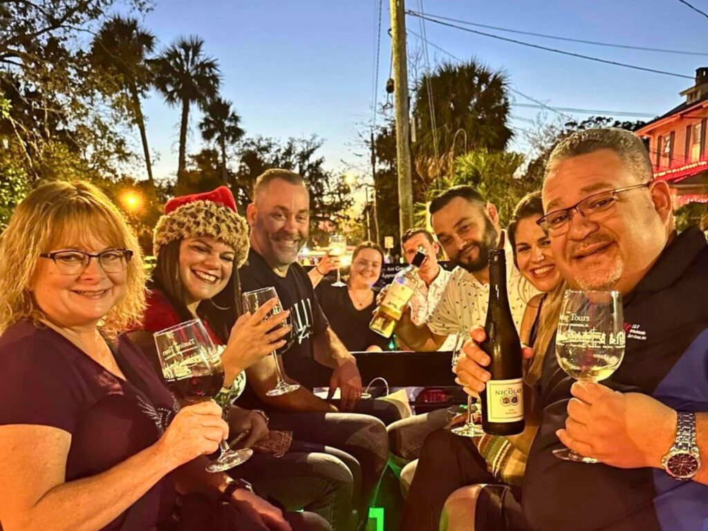 People Enjoying Nights of Lights while drinking wine on a tour