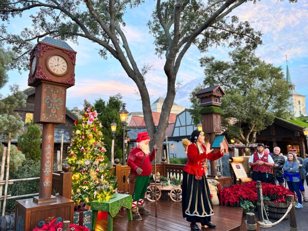 Norway Pavilion Holiday Storytellers perform on a small stage at EPCOT International Festival of the Holidays presented by AdventHealth 