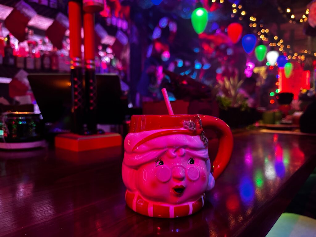 Permanent Vacation Tiki Bar Maitland Christmas Decorations and Cocktails including a mrs. claus mug