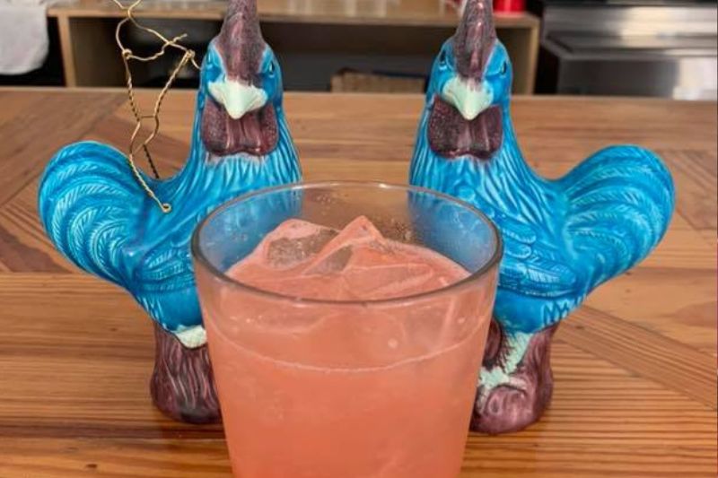 The Blue Hen Cafe serves mimosas in print glasses.