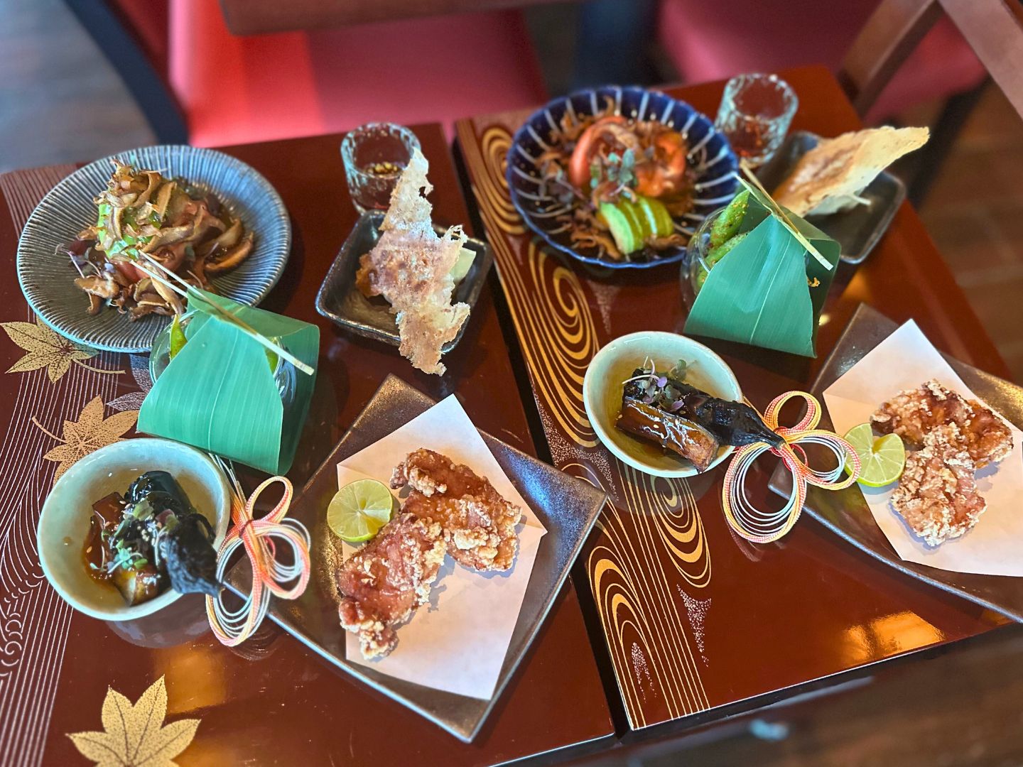 Image of a table full of entrees and side dishes at EPCOT’s Shiki-Sai