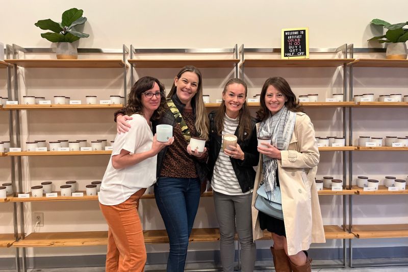 Four women make candles at Artifact for girls' night out