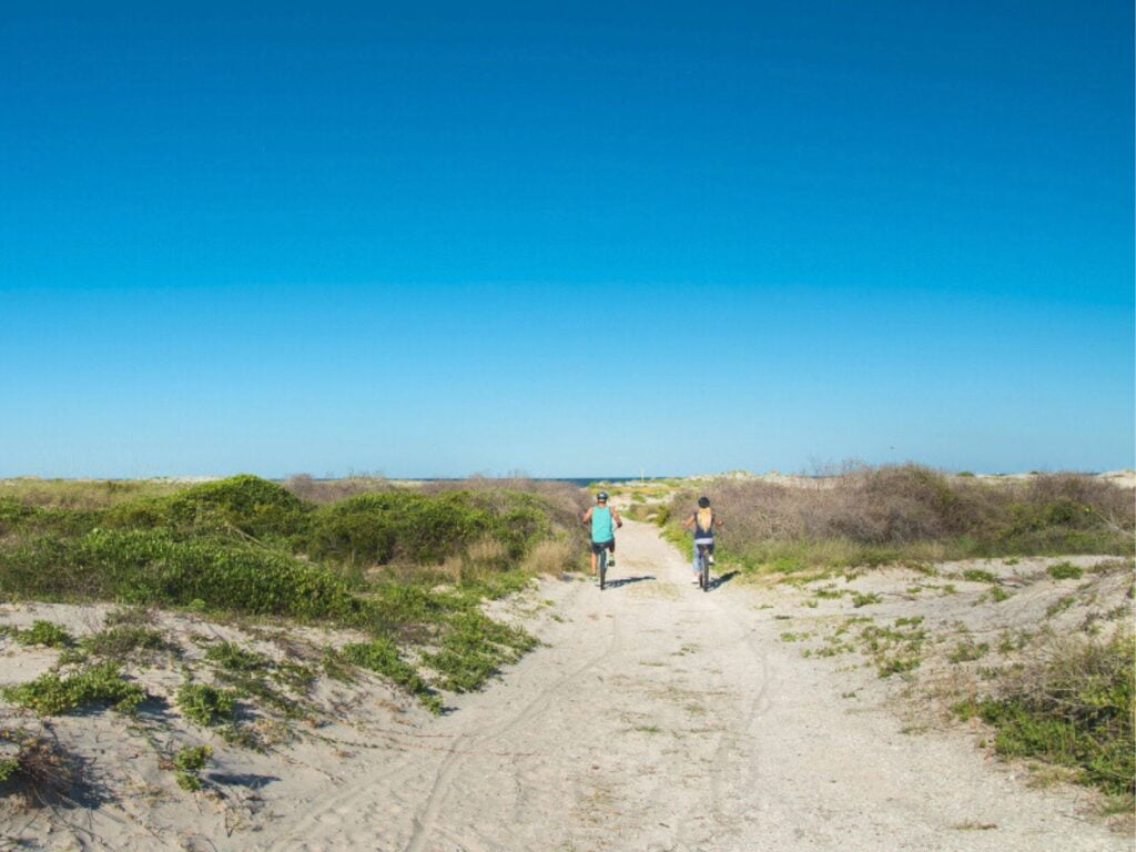 Image of two people riding bikes on the beach at Little Talbot Island State Park