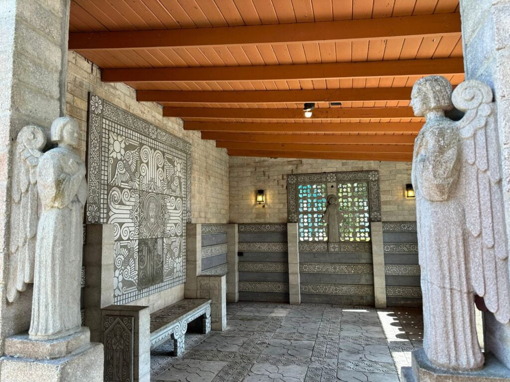 concrete angels and intricate artwork at Outdoor Chapel at Maitland Art and History Museum 