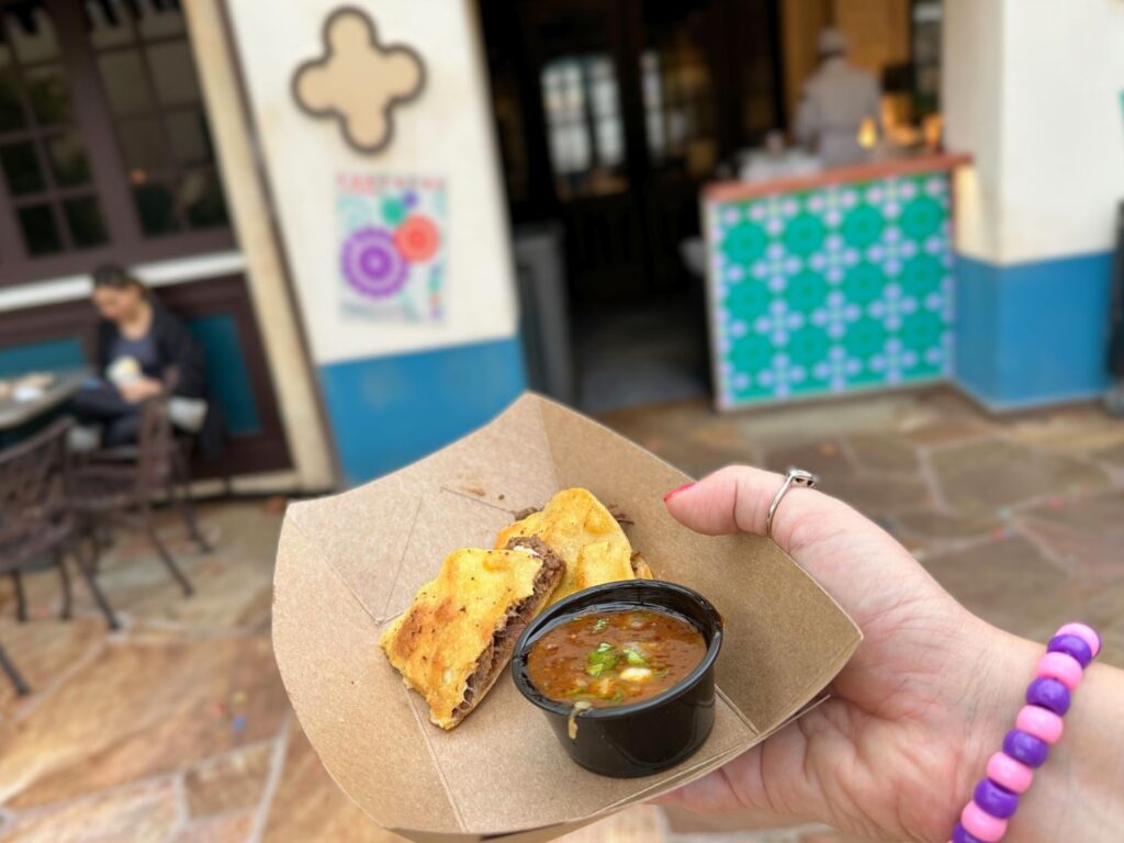quesabirria served with birria broth at Mexico Booth Universal Mardi Gras 2024 