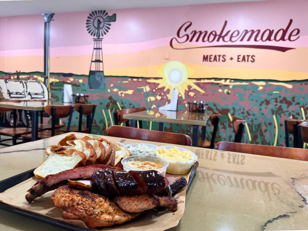 Platter of smoked and BBQ meats plus sides at Smokemade Meats + Eats in Orlando 