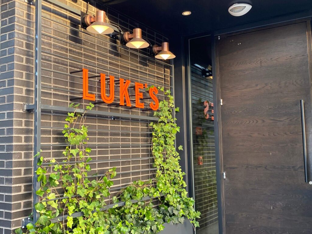 Entrance to Luke's Kitchen and Bar in Maitland with brick wall and ivy