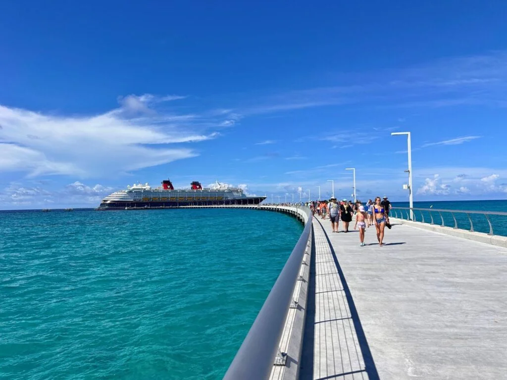 Lookout Cay pier long walkway facing Disney Magic ship