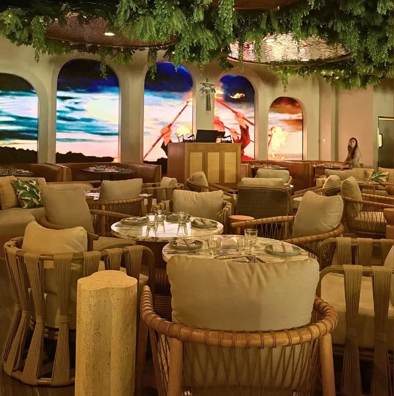 Palm Tree Club Dining Area with Sunset Ambiance