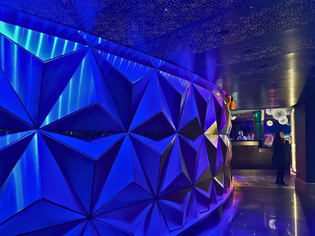 GEO-82 Adults Only Lounge at EPCOT arrival corridor spaceship earth wall - image by Dani Meyering