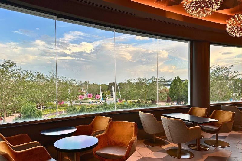 GEO-82 Adults Only Lounge at EPCOT dining area daytime view with seating - image by Dani Meyering feature
