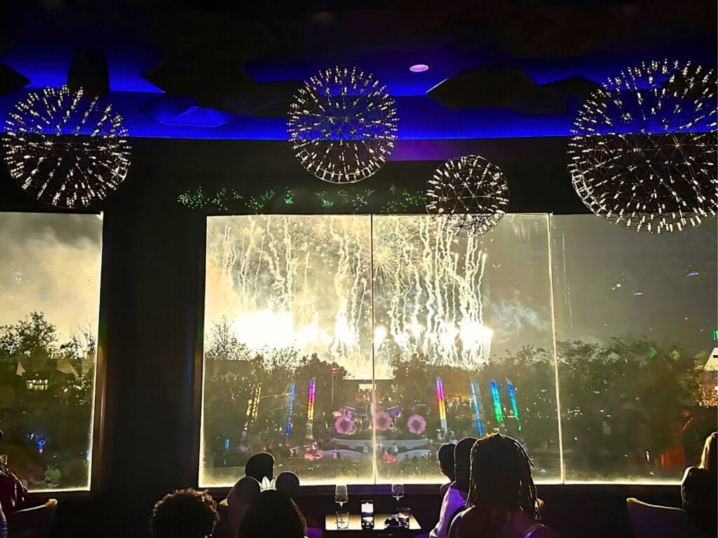 GEO-82 Adults Only Lounge at EPCOT dining area with view of EPCOT Fireworks finale - image by Dani Meyering compress