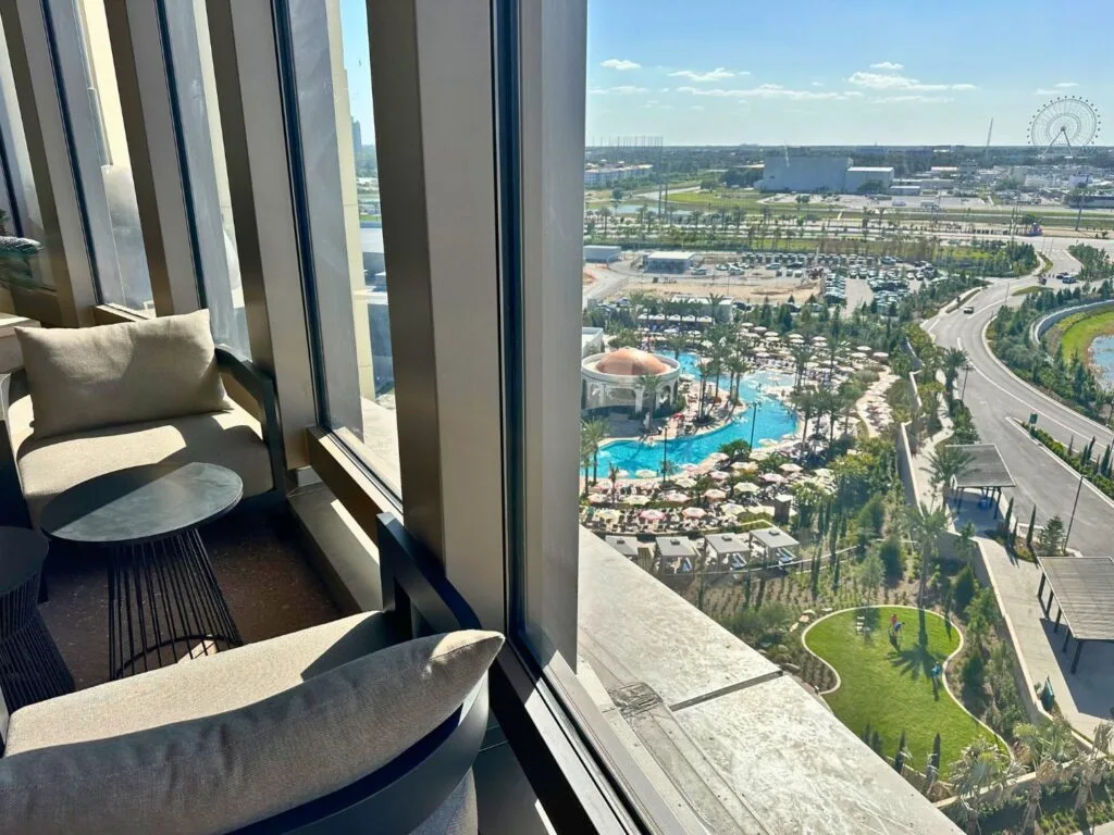 View of Helios Grand Hotel Pool and International Drive from up above at Bar Helios during the day - image by Dani Meyering