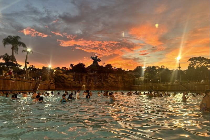 Typhoon Lagoon Surf Pool at H2O Glow Night with a gorgeous sunset in the background