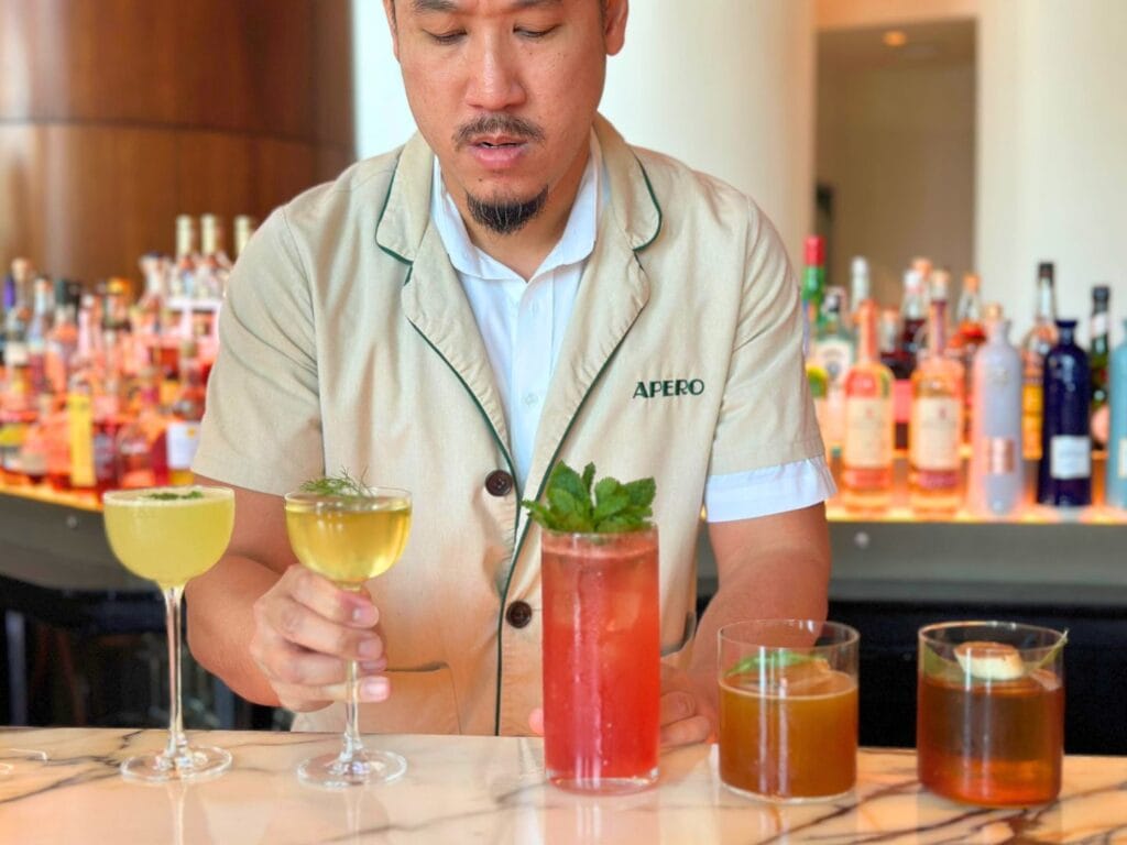 Bartender serves fresh cocktails at Apéro at Conrad Orlando - image by Dani Meyering