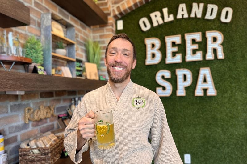 Father's day gift ideas orlando beer spa man holds mug with beverage - image by Dani Meyering
