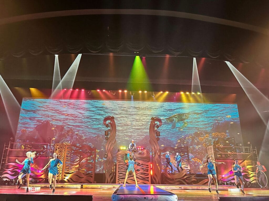 multi colored lights and performers during Hydro Surge stage show Summer Spectacular SeaWorld Orlando - image by Dani Meyering